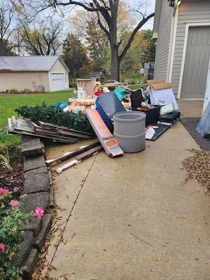 Dumpster being loaded with debris for 3 Yard Dumpster Rental in Laurel Bay